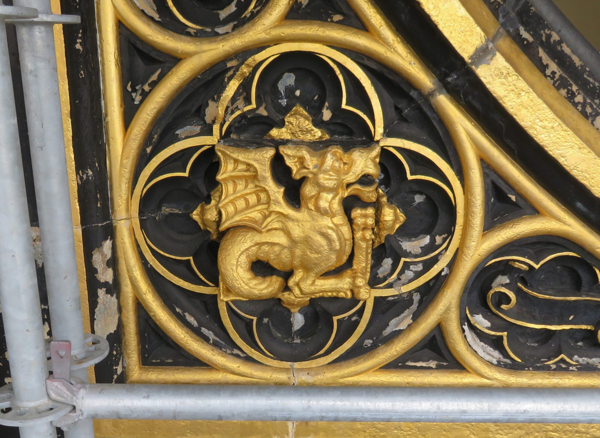 The Welsh Dragon on the North Clock Face before restoration  began showing the 1983 decorative scheme