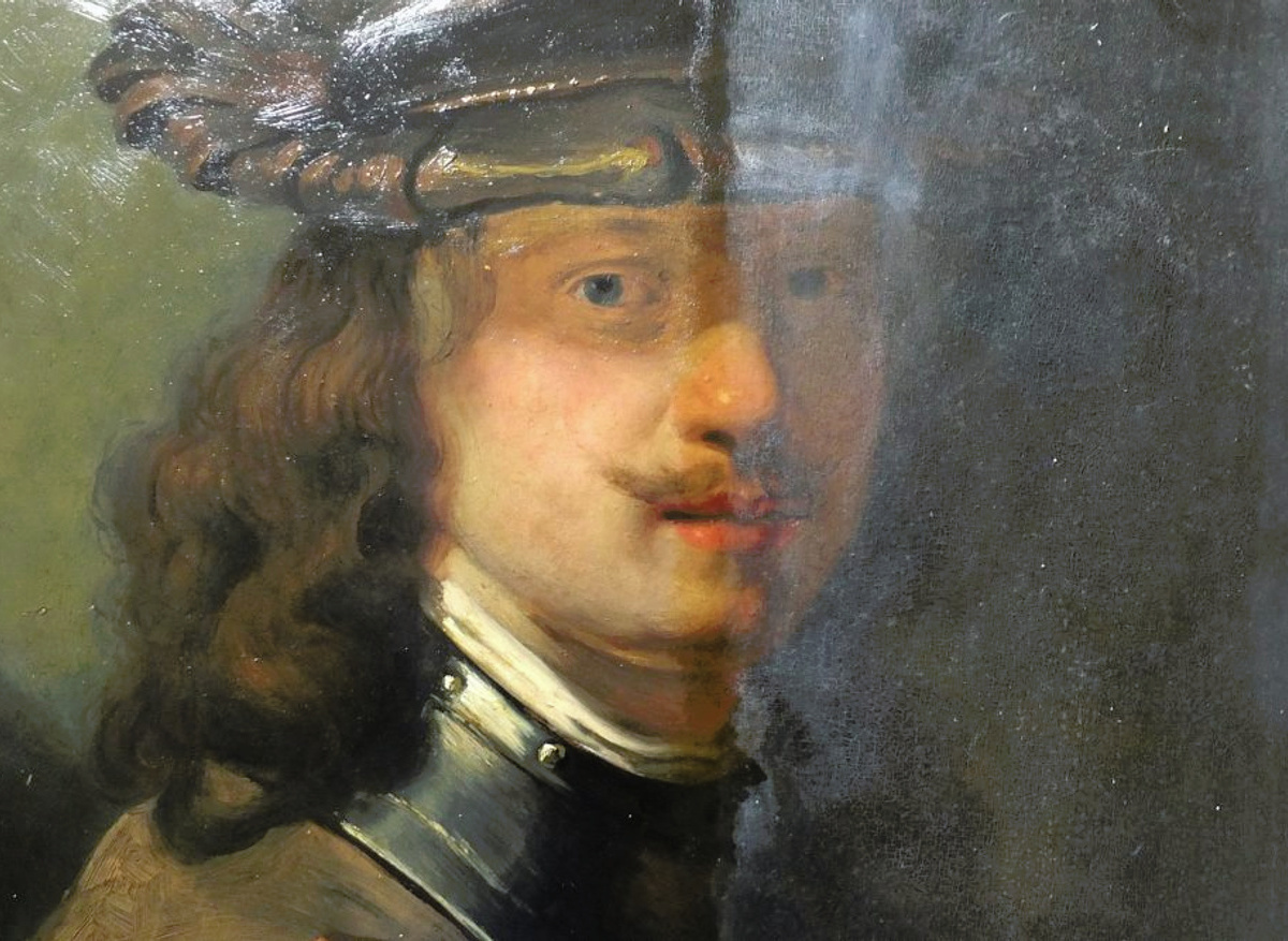 Portrait of a young man with shaded eyes, after Rembrandt. During removal of discoloured varnish. 