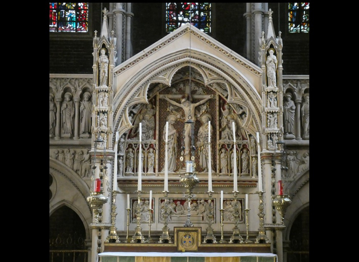 1860s limestone and polychrome reredos in St Augustine Church, Kilburn, London