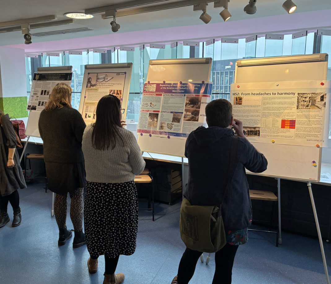 Fig.9 Conference attendees taking time to read the variety of posters on offer.png