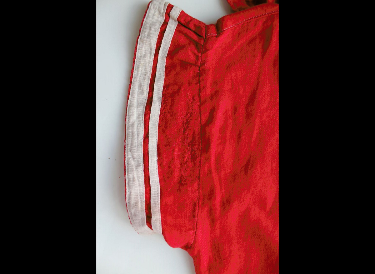 After conservation detail of stitch repair on swimming costume