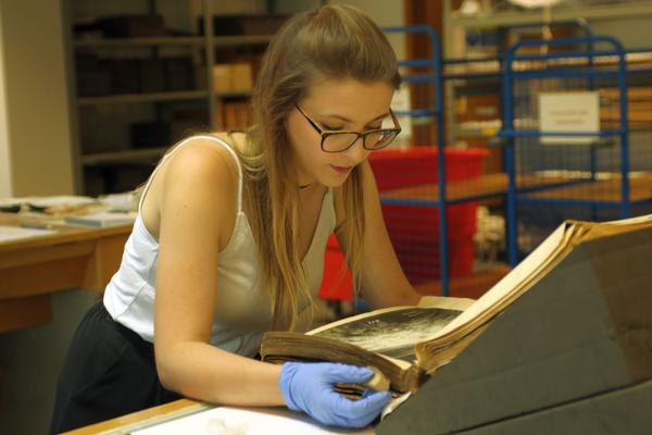 image_2_cleaning_album_of_dockyard_photographs_at_the_national_archives.jpg