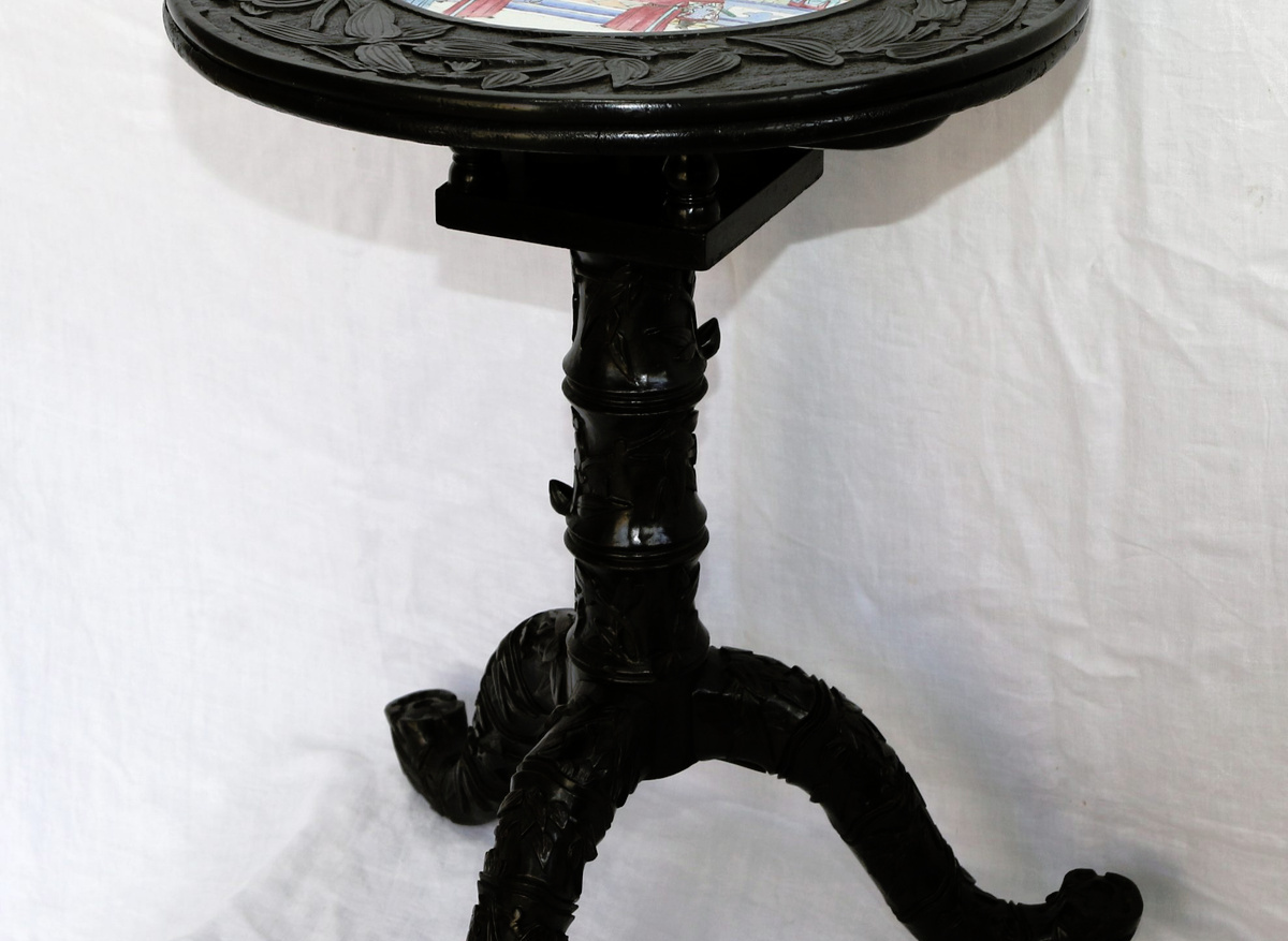 Chinese ebonised and lacquered tripod table with porcelain plaque