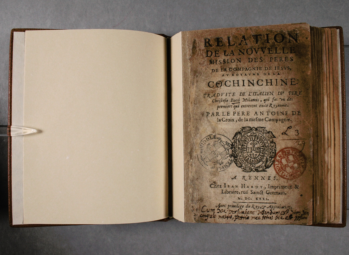Extensive paper infills and a custom-made guard book structure to house an extremely fragile, smoke damaged rare book