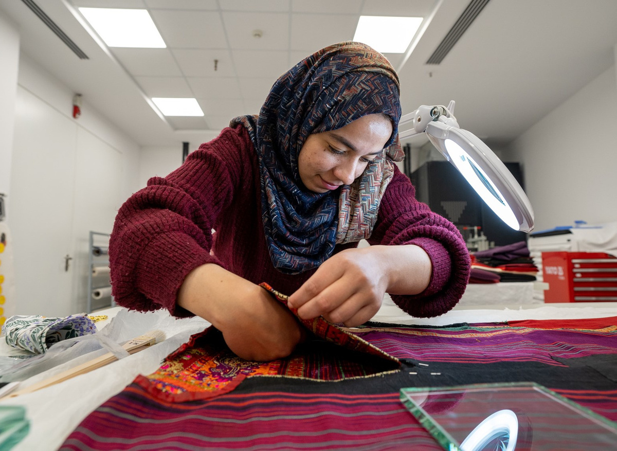 Bara undertakes a stitched treatment on a thobe