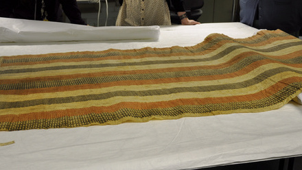ethnography tapestry textiles on conservation desk.JPG