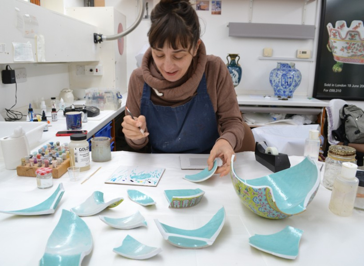 Jasmina retouching the rivet holes before bonding