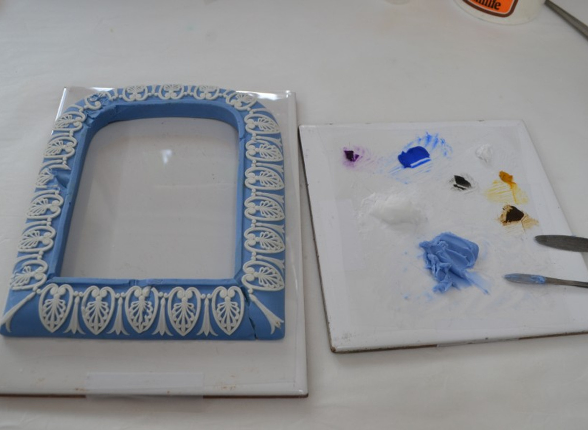 The frame was repaired using the colour fill technique. Colour filling is a short course we teach.