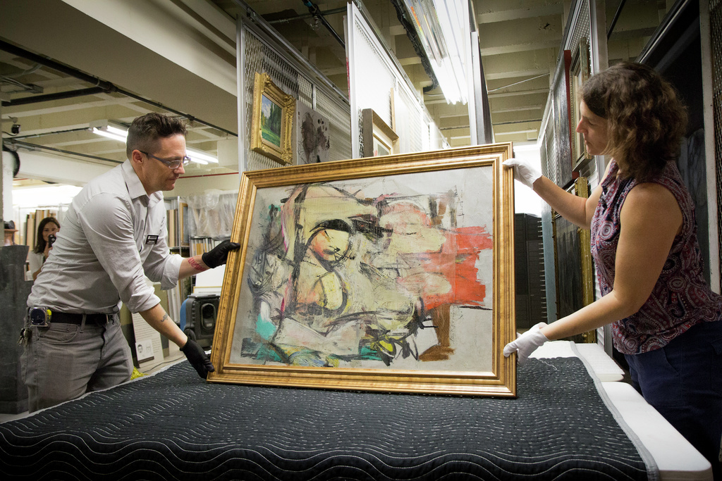 UAMA staff members Nathan Saxton and Kristen Schmidt inspecting Woman-Ochre.jpg