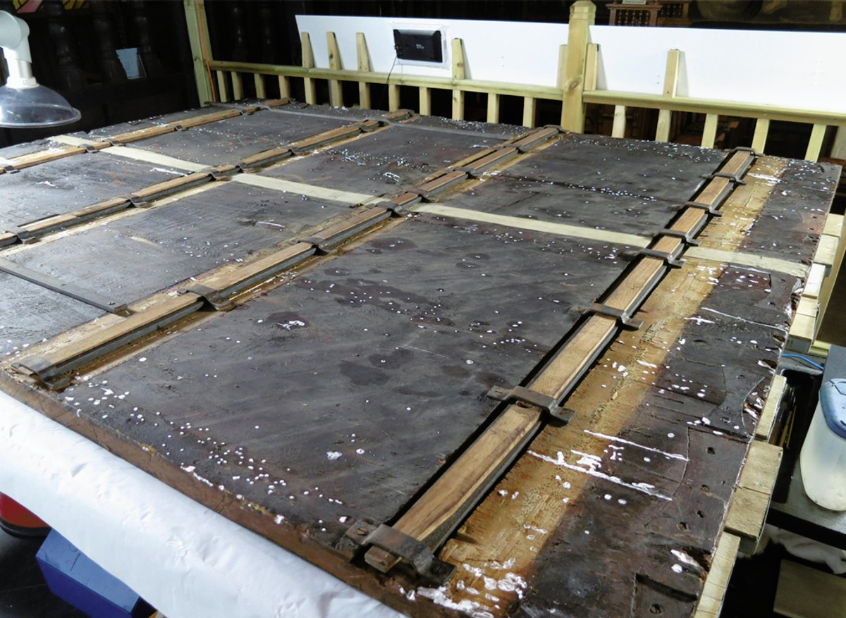 During treatment of the back of the panel