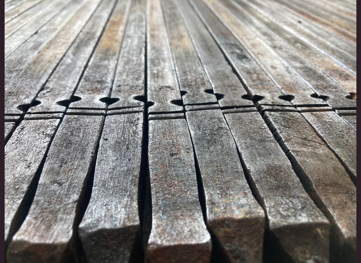 Railings of Dowdeswell church after flame cleaning, prior to straightening.