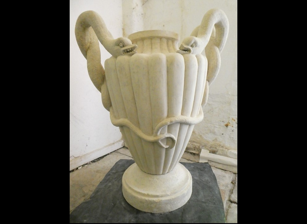 One of two late 18th century limestone urns 