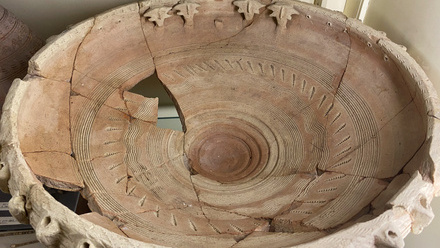 ancient clay dish plate with cracks and missing pieces.jpeg