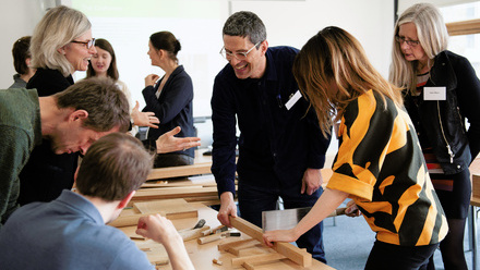 Icon Adapt people at a wood workshop conference.jpeg