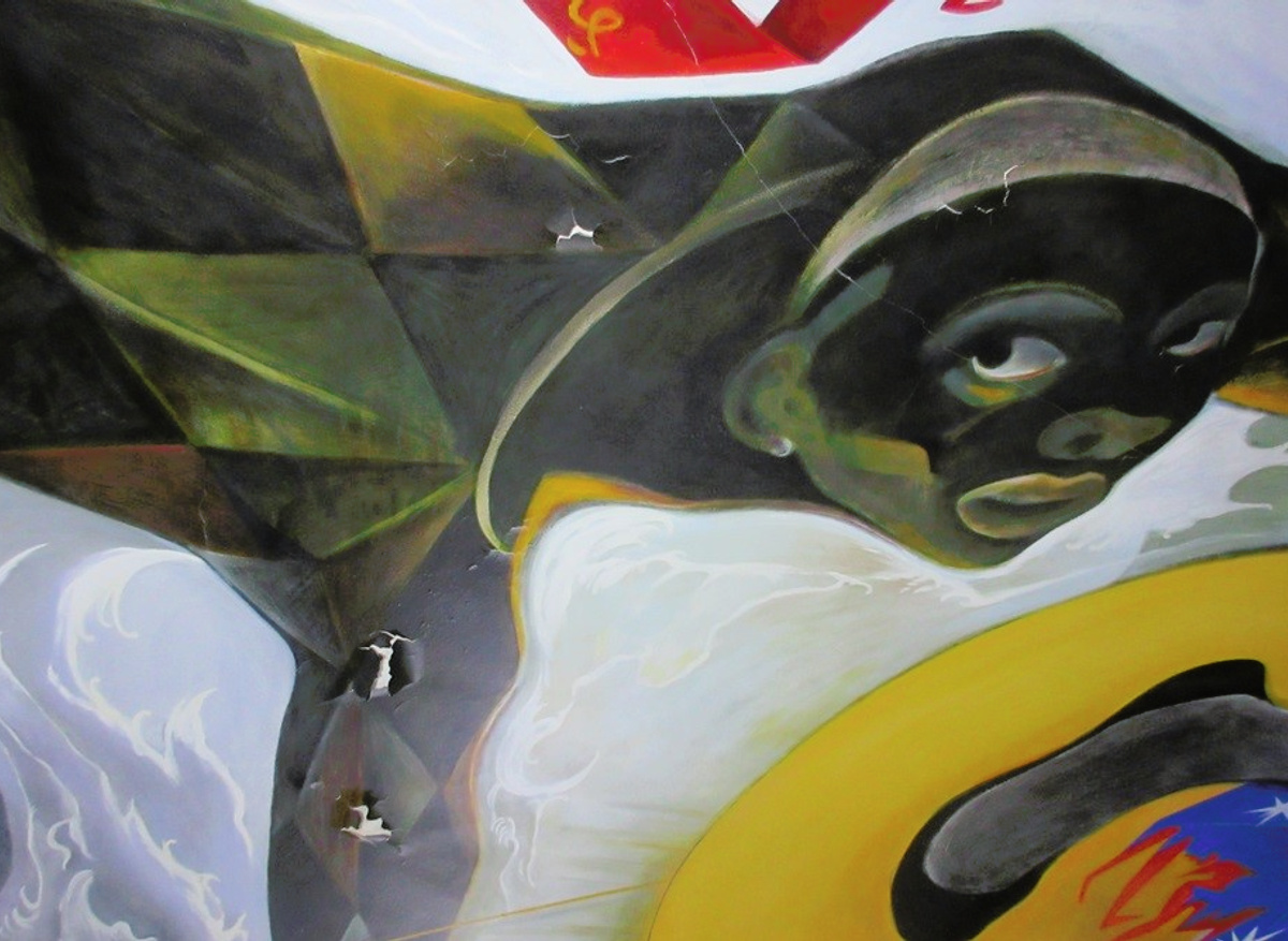 Harlequin figure detail before treatment.
