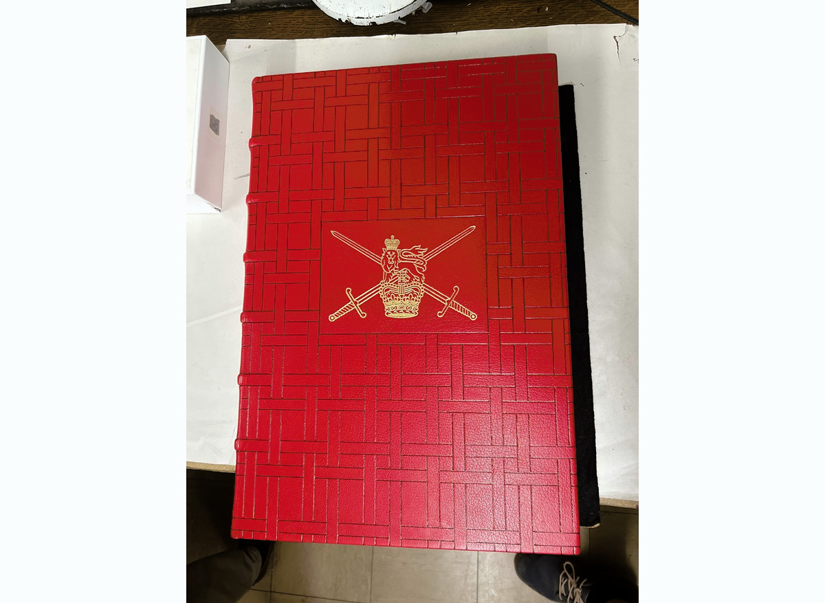 Blind tooling to front board with Army crest added in  gold leaf