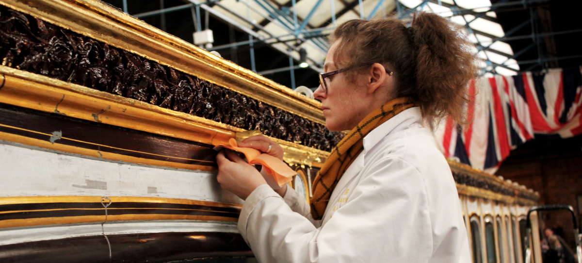 Conservator Wendy Somerville-Woodiwis re-gilding Queen Victoria's Saloon