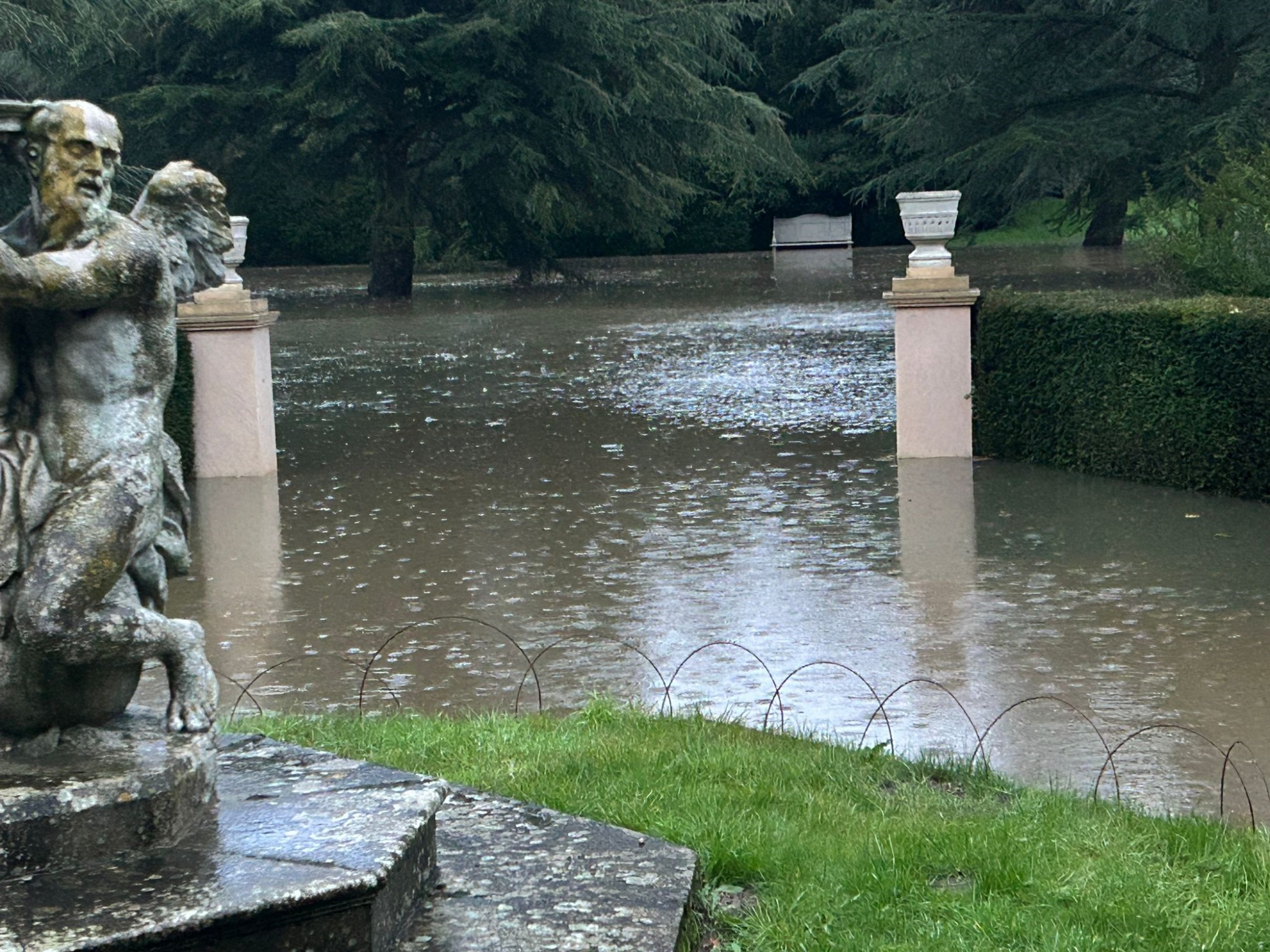 In the Dutch Garden at Belton, the Father Time sundial is encroached by water. (C) National Trust.jpeg