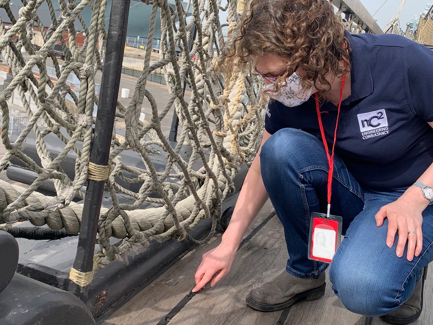 NMRN: Rachel Triggs examining deck of HMS Victory_Credit_University of Southampton.jpeg