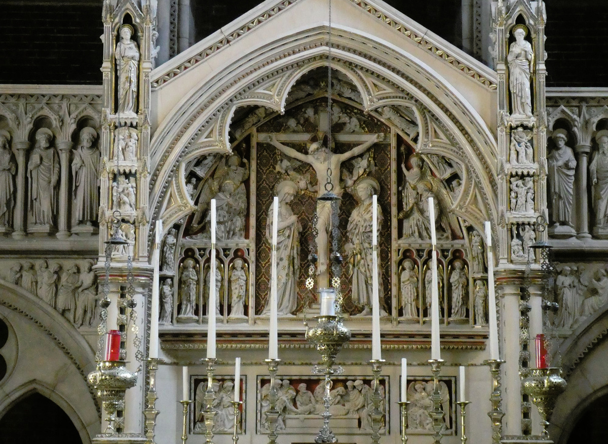 1860s limestone and polychrome reredos in St Augustine Church, Kilburn, London