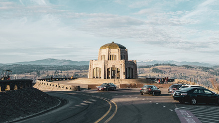 heritage building on the road with cars