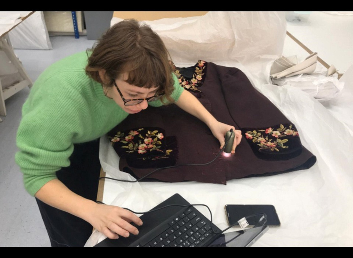 Undertaking visual analysis of damage to a late 19th century smoking jacket from Manchester Museums