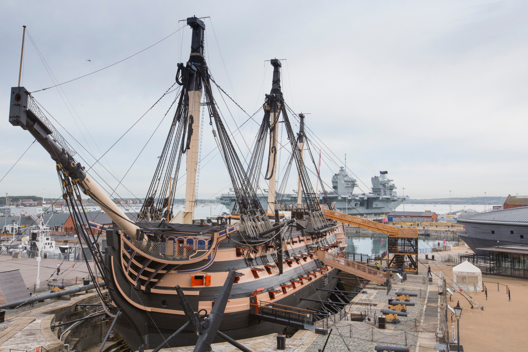 NMRN HMS Victory with HMS Queen Elizabeth in background_Credit_NMRN.jpg