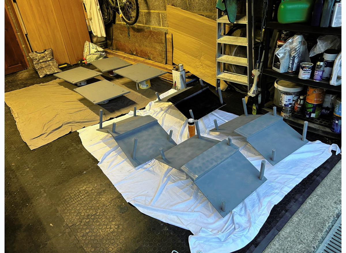 Part assembled cradles being sprayed black in my rather messy garage