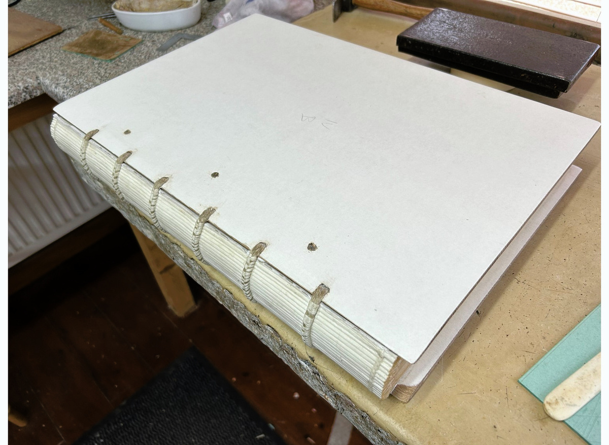 Boards laced on with oval softwood pegs to hold cords in place